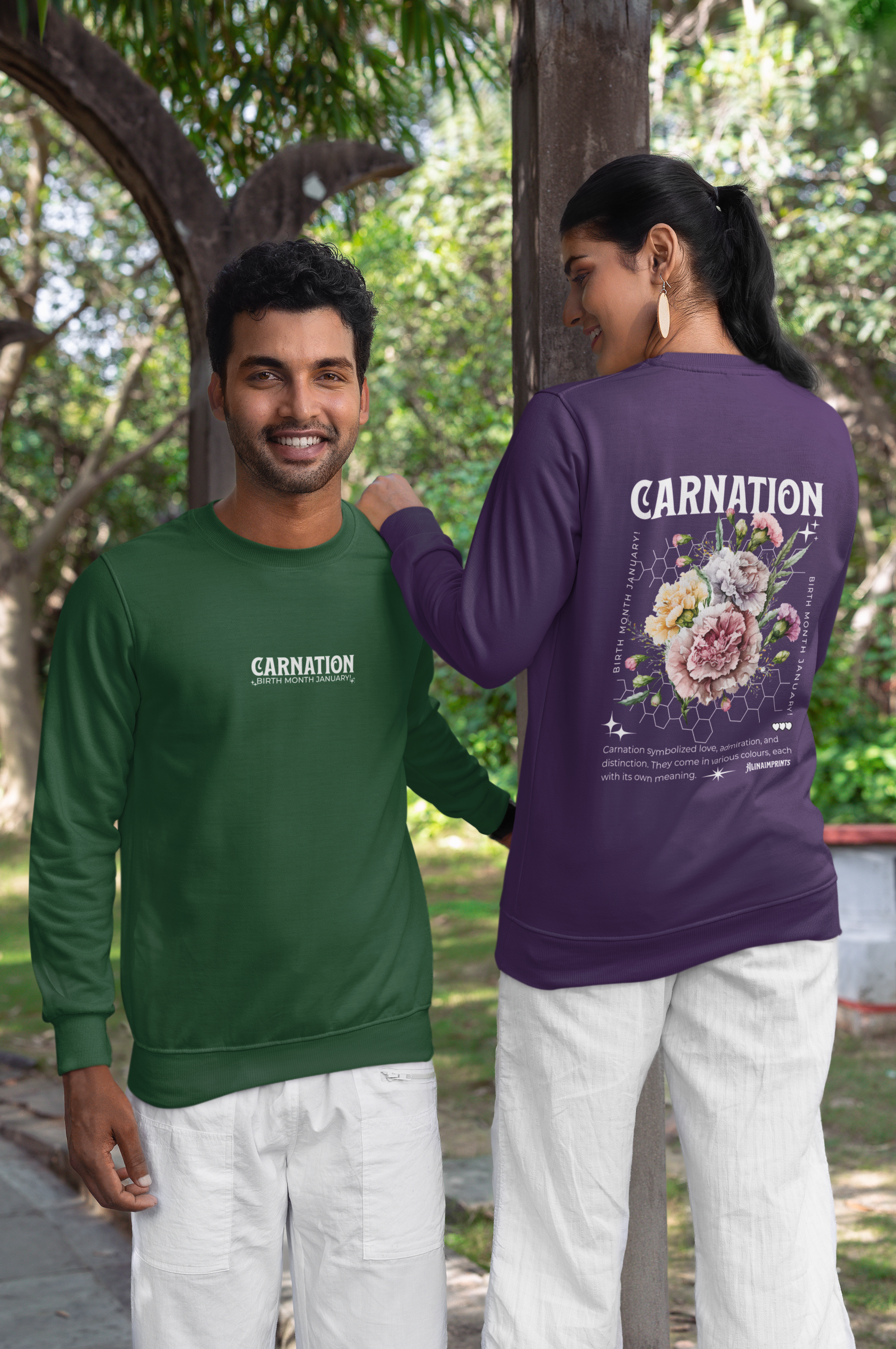 Couple wearing green and purple sweatshirt